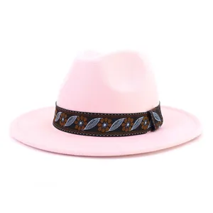 Pink wool felt fedora hat featuring an ethnic woven band, wide flat brim detail view.