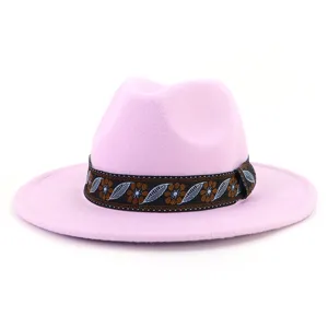 Pink wool fedora hat detail, elegant ethnic patterned band, stylish wide brim jazz hat accessory.