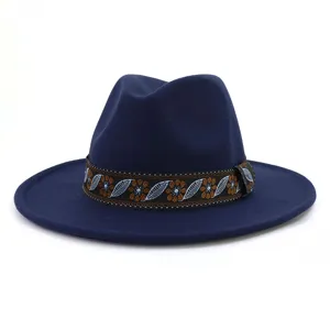 Close-up detail of navy blue wool fedora hat featuring ethnic floral woven band.