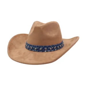 Detailed view of a brown suede western cowboy hat featuring a stylish studded denim band.