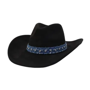 Detailed view of black suede cowboy hat with blue denim rhinestone studded hatband, stylish.