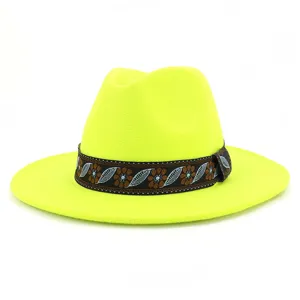 Close-up detail of the ethnic pattern ribbon and neon yellow woolen fabric texture.