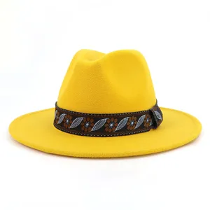 Close-up view of the bright yellow felt fedora hat featuring an ethnic-style decorative band.