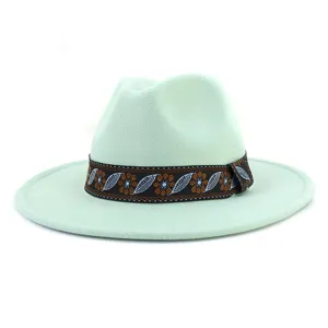 Mint green felt fedora hat featuring a stylish ethnic embroidered band for detailed view.