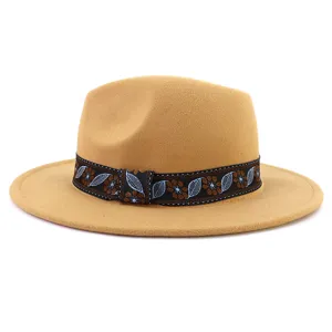 Ethnic style embroidered ribbon detail on camel felt fedora hat, classic vintage fashion.