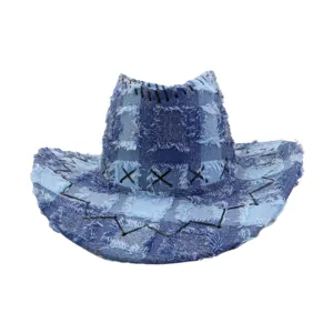 Frayed denim patchwork western cowboy hat detail showing rustic cross stitch design.