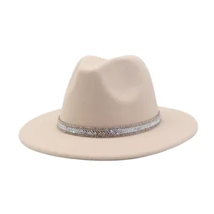 Close-up detail of the elegant beige wool fedora hat featuring a sparkly rhinestone band.