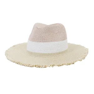 Detailed view of the color-blocked straw sun hat with frayed wide brim for outdoor summer style.
