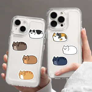 Clear phone case detail featuring cute cartoon cat loaf designs and transparent soft TPU.