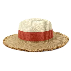 Detail shot of the stylish color-blocked straw hat featuring a frayed fringe wide brim.