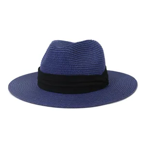 Blue straw hat detail view, classic jazz fedora style with black band, summer beach wear.