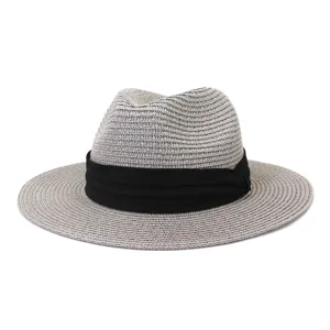 Close-up view of the grey straw fedora hat with black ribbon, fine weave texture detail.