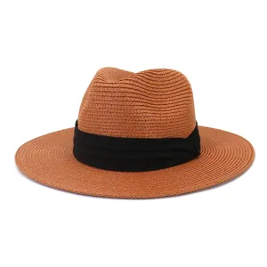 Detailed close-up shot of the woven straw texture and black ribbon band on this classic sun hat.