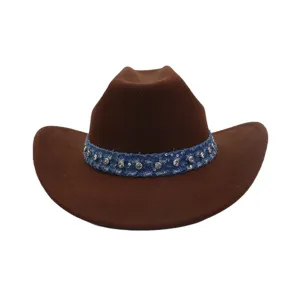 Detail shot of brown wool cowboy hat featuring blue denim band with sparkling rhinestones.