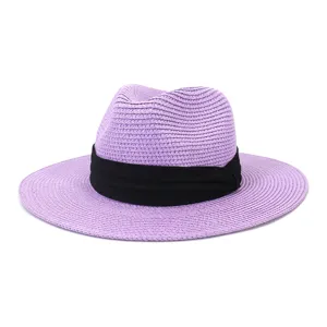 Purple straw fedora hat with black band for outdoor beach sun protection, summer style.