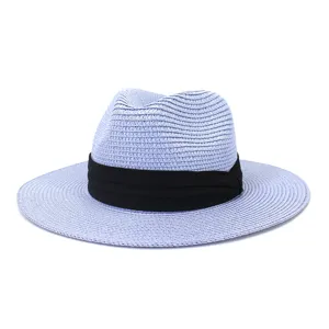 Close-up detail of light blue straw fedora hat showing fine woven texture and ribbon.