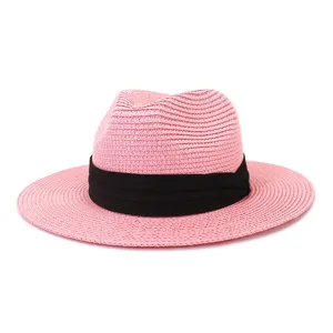 Pink straw fedora hat detail view, stylish summer beach sun protection hat with black band