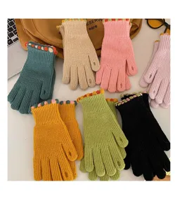 Women's winter knit touch screen gloves with cute bobble cuffs, warm and stylish daily wear.