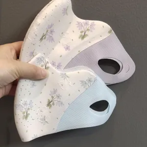 Masque facial anti-UV d'été à imprimé floral avec design 3D et protection des coins des yeux.