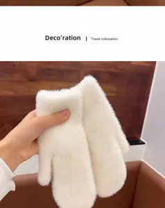 White plush mittens detail view, soft winter warm fleece gloves closeup product display.