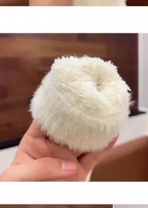 White plush winter glove detail, thick fluffy warm fleece material for cold weather daily wear.