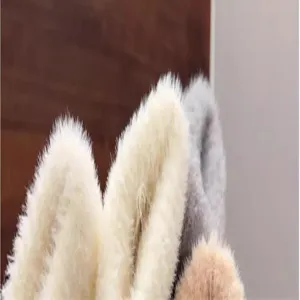 Plush winter warm gloves detail shot, soft fuzzy fleece fabric for cold weather protection.