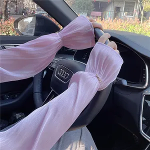 Detail shot of pink ice silk sun protection arm sleeves, breathable and stylish for driving.