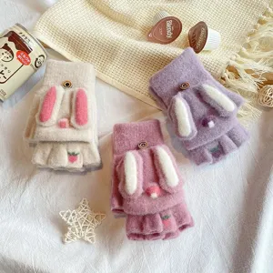 Detailed close-up shot of cute plush half-finger flip-top winter gloves with sweet rabbit ears.
