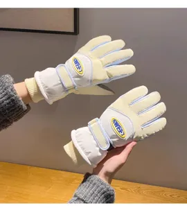 Winter thermal windproof cycling gloves detail showing warm velvet lining and secure wrist strap.