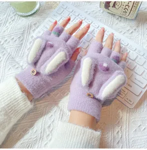 Close-up detail of cute purple mink velvet fingerless gloves with rabbit ears for winter.