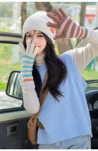 Winter knitted long striped touchscreen gloves and warm hat set for women outdoor daily wear.