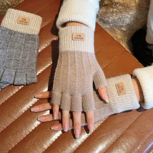 Close-up detail of winter knitted fingerless gloves showing soft texture and cozy fit.