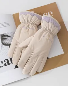 Detailed view of women's warm winter fleece-lined gloves with elegant scalloped cuffs.