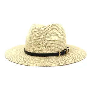 Detailed view of the women's straw sun hat texture, featuring a black belt and metal buckle decor.