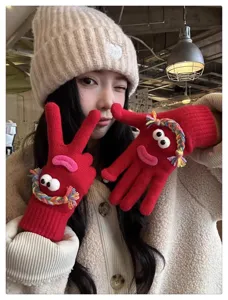 Funny monster design red knit gloves, cute and cozy winter thermal detailed view showcase.