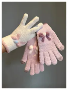 Cute bow knit touchscreen gloves detail view, soft warm winter thermal mittens for women.