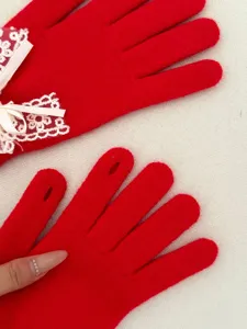 Women red knit gloves winter warm touch screen cute lace bow thermal gloves detail view.
