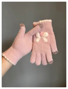 Pink knit touchscreen gloves for women, cute bow design, warm winter five-finger mittens.