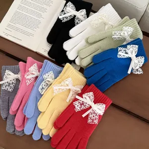 Cute knitted gloves for women with lace bow design, warm winter touchscreen thermal mittens.
