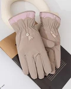 Women's winter warm windproof gloves with Chinese style embroidery and tassel details.