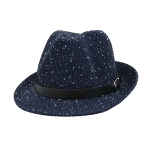 Detailed view of a navy blue sequin fedora straw hat with black belt and metal buckle.