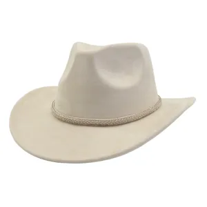Close-up view of a beige suede western cowboy hat featuring a sparkling rhinestone braided band.