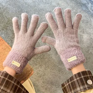 Detailed view of women knitted fleece lined warm gloves with plush cuffs for winter cold.