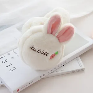 Cozy plush winter earmuffs with cute pink bunny ears, soft and warm foldable ear warmers for women.