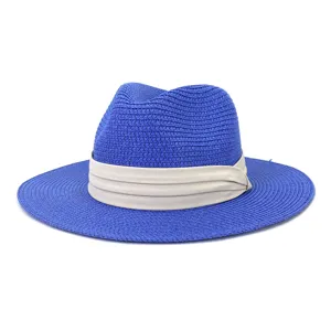 Blue straw fedora hat detail view, classic beige band accessory for summer sun protection.