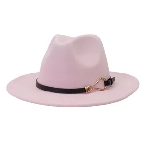 Pink wool fedora hat detail featuring a chic black leather strap and a shiny gold metal buckle.