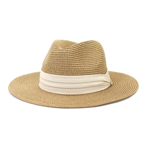 Detailed view of a classic straw fedora hat featuring a wide brim and elegant cream band.