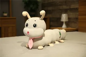 Detailed view of cute caterpillar plush toy with pink scarf, soft long sleeping pillow for kids.