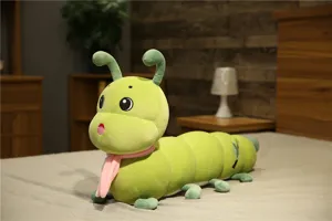 Cute green caterpillar plush toy detail showing soft fabric and pink scarf design.