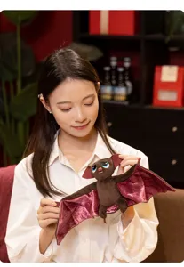 Detailed view of a cute plush bat toy featuring purple wings, ideal for spooky Halloween decor.